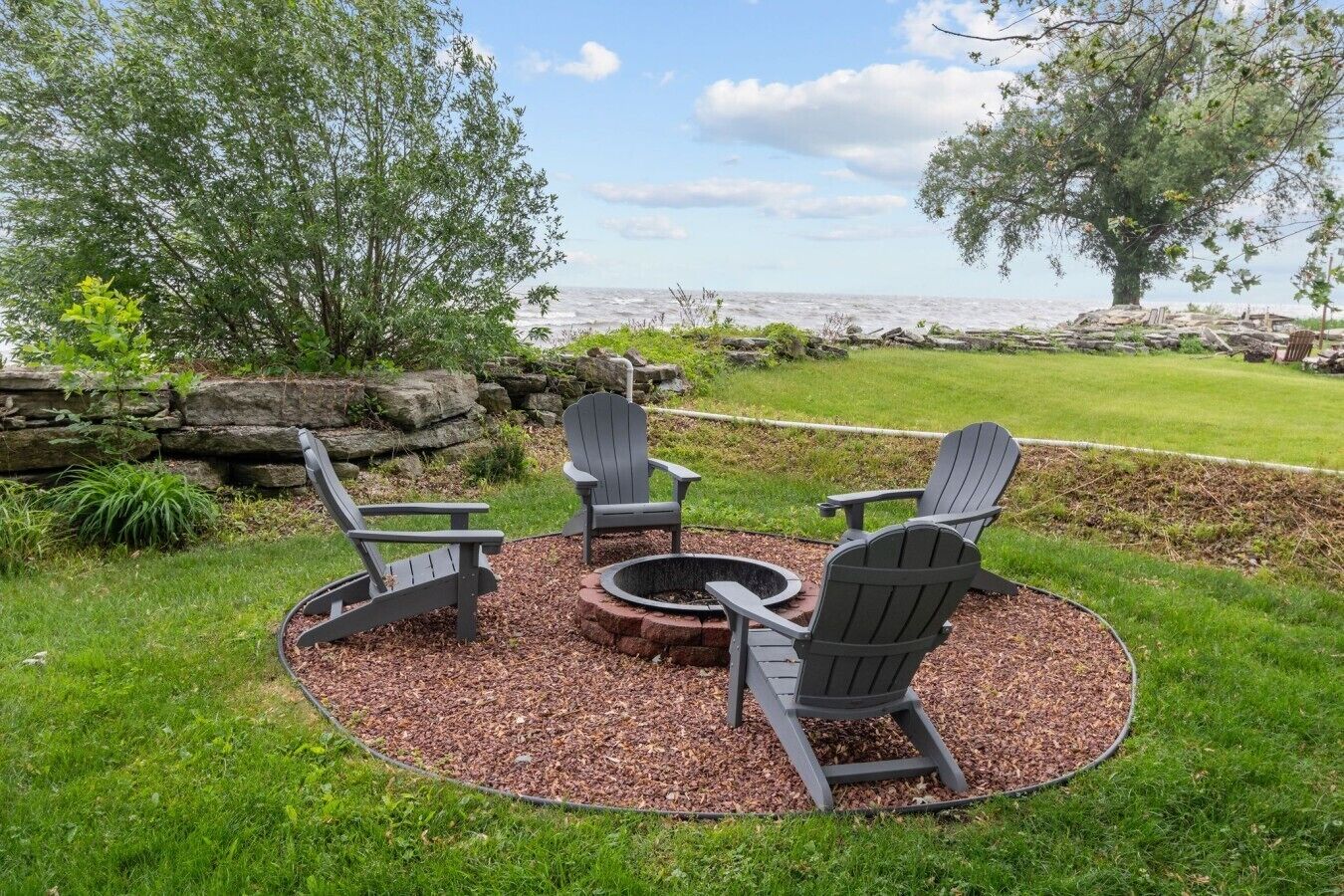Gather around the fire with waterfront views.