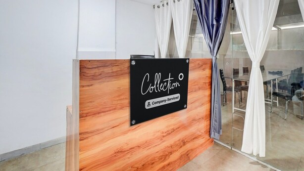 A reception desk with a sign reading 'Collection Company-Serviced.' - Super Collection O Laxmi Chowk Hinjewadi (Paud)