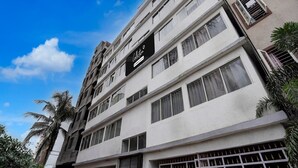 A multi-story building with a sign that reads 'Collector.' - Super Collection O Laxmi Chowk Hinjewadi (Paud)