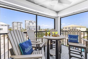 Outdoor dining - Beachfront Escape with Pool, Tiki Huts & Stunning Gulf Views - Casa Bleu - Roelens (Fort Myers Beach)