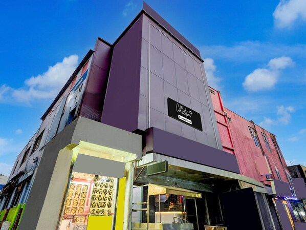 A modern building with a sign reading 'Collection & Company Services'.