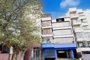 A multi-story building with a sign reading 'Collection'. - Deluxe Super Collection O Banaswadi (Bengaluru)