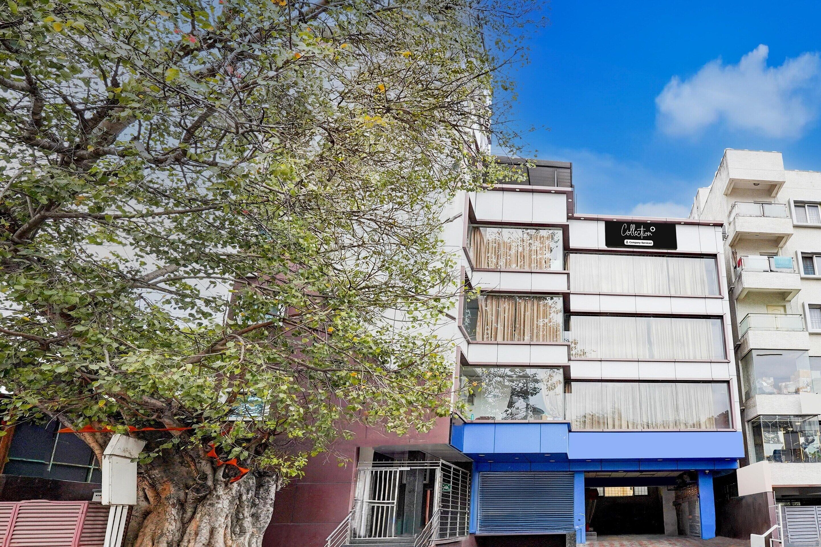 A multi-story building with a sign reading 'Collection.'