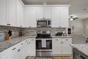 Fridge, microwave, oven, stovetop - New Home in Canyon Lake l Modern Interior (Canyon Lake)