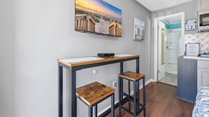 A modern kitchen with a built-in oven, a microwave, and a sink. - Paws & Palms-Pet Friendly-Pool-Free Parking (North Myrtle Beach)