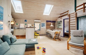 A cozy interior with a sofa, a dining table, and a kitchen area. - Nice home in Haarby with WiFi (Haarby)