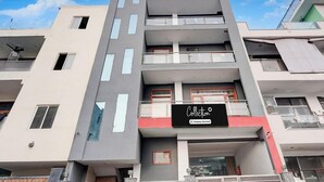 A multi-story building with a sign reading 'Collection Company-Serviced.' - Super Collection O Sector 20 Noida (Noida)