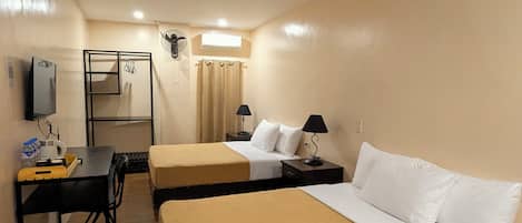Habitación familiar | Escritorio, wifi gratis y ropa de cama