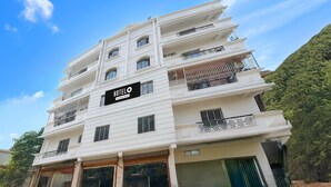 A multi-story hotel with a sign reading 'HOTEL O' and balconies on each floor. - Classic With Balcony Shibpur Tram Depot (Howrah)
