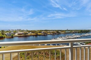A marina with boats docked, a river, and buildings in the background. - Waterfront Escape at Yacht Club Villas | Pool, Golf & Barefoot Landing Nearby (North Myrtle Beach)