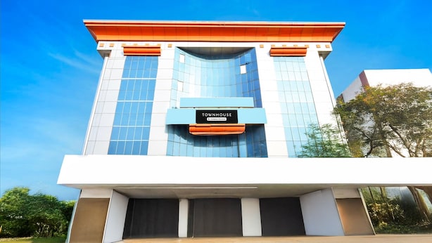 A modern building with a sign reading 'TOWNHOUSE.' - Deluxeameerpet Balkampet Road (Hyderabad)