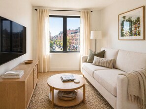 Quarto luxo, vista para a cidade | Área de estar