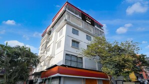 A multi-story building with a sign that reads 'Collector.' - Premium Super Collection O Tollygunge (Kolkata)