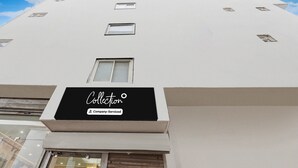 A building with a sign reading 'Collection Company-Serviced.' - Saver Singlehotel Lotus (New Delhi)