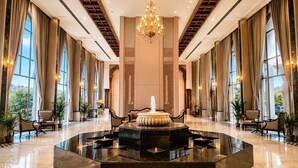 A spacious lobby with a central fountain, large windows, and elegant chandeliers. - Treat Imperial Hridhaan Udaipur (Udaipur)