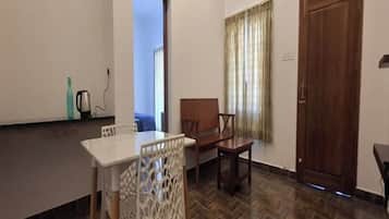 Double Room | Living area | 32-inch flat-screen TV with cable channels