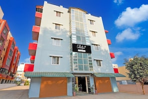 A multi-story building with a prominent sign reading 'Collection & Company Services.' - Super Collection O Electronic City (Anekal)