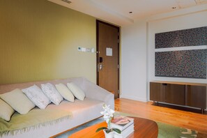 Signature Condo, 1 Bedroom | Living room | 45-inch Smart TV with digital channels - The Hotel Residences at Acqua (Mandaluyong)
