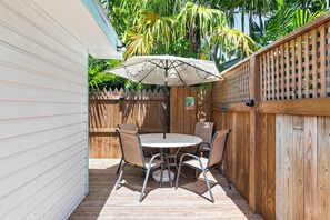 Outdoor dining - Shared Pool + Backyard Lounge | Charming Cottage | Steps to Waterfront Dining (Key West)