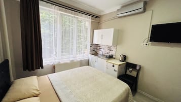 Premium bedding, desk, laptop workspace, free WiFi