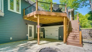 A two-story house with a covered deck, a fire pit, and a garage. - 2 Mi to Dale Hollow Lake! 'Shadowood' Group Escape (Byrdstown)