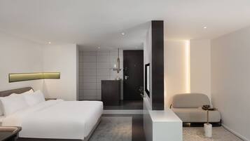 Quarto duplo superluxo, vista para a cidade | Edredons de pluma, escrivaninha, cortinas blackout