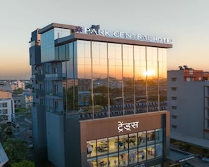 A modern hotel with a glass facade, a sign reading 'Park Central Hotel,' and a visible store on the ground floor. - Hotel Park Central  (Ahilyanagar)