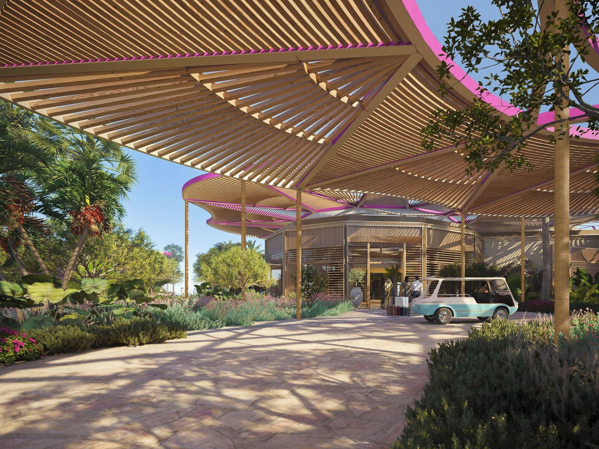 A covered outdoor area with a curved wooden structure, a pathway, and a vintage car parked under the canopy.