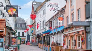 A street lined with shops and a hotel named 'Hotel Jomfru Aane.' - 1 Person Holiday Park Home in Aalborg (Aalborg)