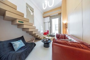 Dúplex superior, vista a la ciudad | Sala de estar