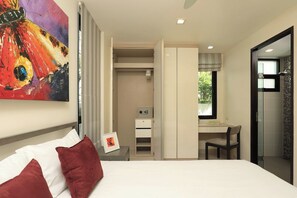A hotel room with a bed, a desk, a walk-in closet, and a shower area. - Laguna Park | Bangtao Beach | 5-bedroom Pool Villa (Bangtao)