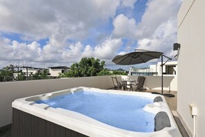 A rooftop swimming pool with a hot tub, outdoor furniture, and a large umbrella. - Laguna Park | Bangtao Beach | 5-bedroom Pool Villa (Bangtao)