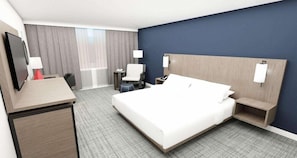 Habitación de hotel con cama, escritorio, silla, mesitas de noche, lámparas y televisor.
