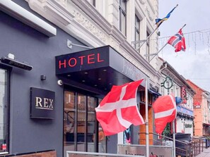 A hotel facade with a prominent 'HOTEL' sign, a 'REX' sign, and two Danish flags. - 2 Person Holiday Park Home in Aalborg (Aalborg)