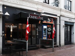 A hotel entrance with a black facade, a reception desk, and a cash machine. - 2 Person Holiday Park Home in Aalborg (Aalborg)