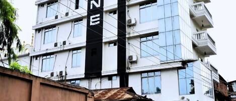 A multi-story building with a prominent black vertical sign reading 'CITRINE.'