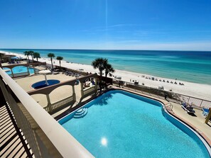 A pool area with a view of the beach and ocean. - Gulf-Front w/ Balcony Views & Family Comfort Free Golf & Activities Daily! (Panama City Beach)