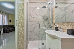 Comfort Double Room, Patio | Bathroom | Shower, hair dryer, towels, soap