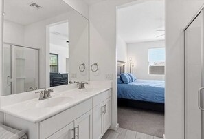 Shower, hair dryer, towels, shampoo