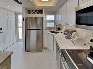 Fridge, microwave, oven, stovetop - Pointe South 103 | Stunning Views + Pool (Fort Myers Beach)