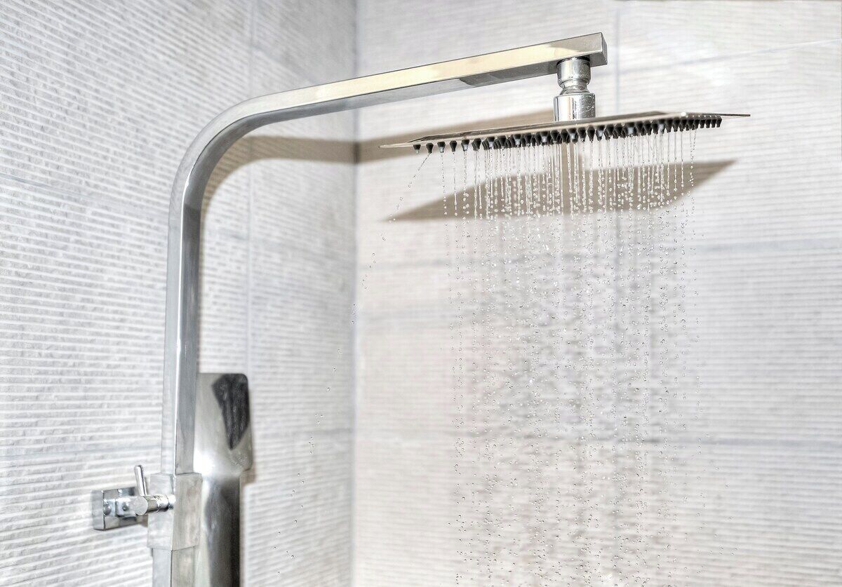 A showerhead with a curved design and multiple water jets.