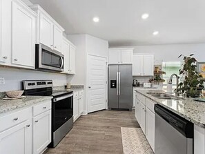 Fridge, microwave, oven, stovetop - Home in Windmark Beach - 2 Pools - Private MIL Suite - Golf Cart Included (Port St. Joe)