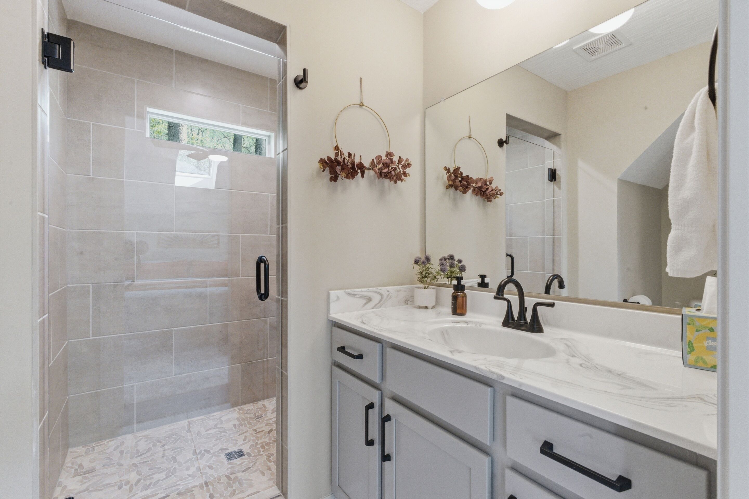 Shower, hair dryer, towels, soap