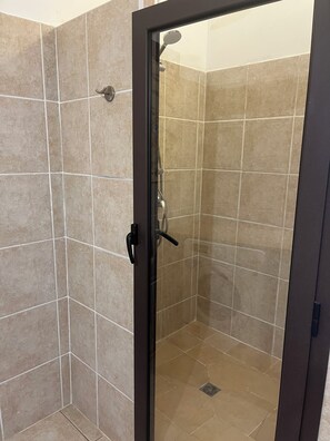 Shower, hair dryer, towels, toilet paper
