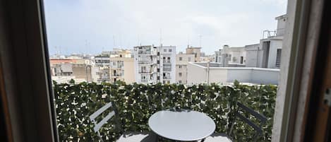Deluxe Triple Room, Balcony, City View | Terrace/patio