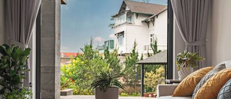 Deluxe Apartment, Garden View | Living area | 43-inch Smart TV with digital channels