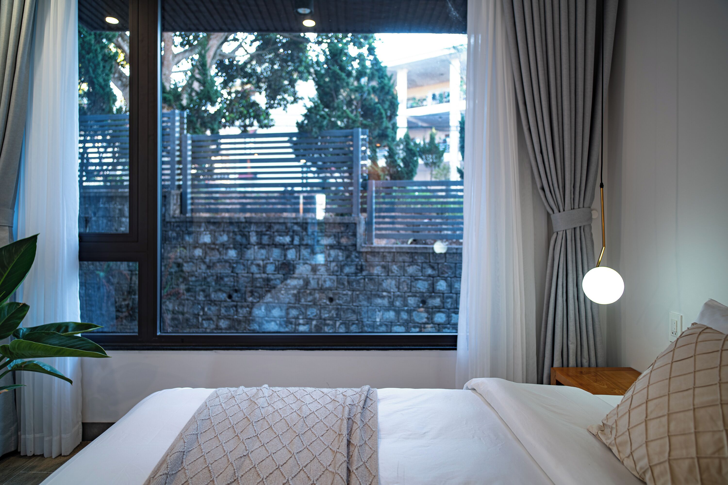 Deluxe Quadruple Room, Courtyard View | Desk, blackout curtains, soundproofing, iron/ironing board