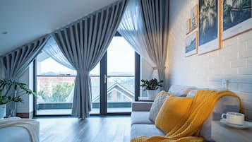 Luxury Quadruple Room, Balcony, Mountain View | Living area | 43-inch Smart TV with digital channels