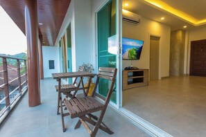 Outdoor dining - 2BR Walk Award Winning Beach Pool & Gym C126 (Tambon Rawai)