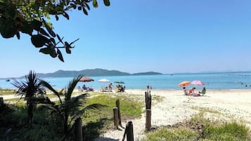 Apartment, Balcony, Partial Sea View | Beach | On the beach, white sand, beach umbrellas